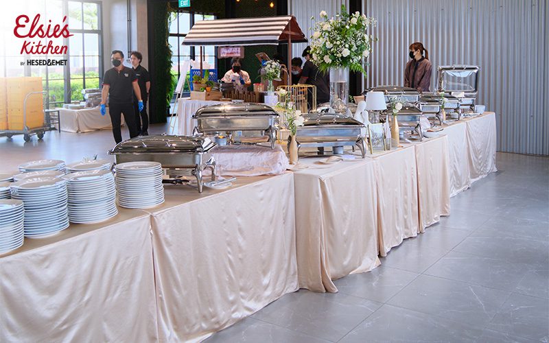 Elsie's Kitchen rustic buffet setup with elegant floral decor