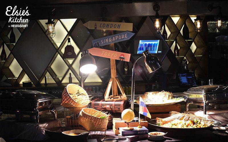 Hot buffet stations featuring grilled fish and international appetizers