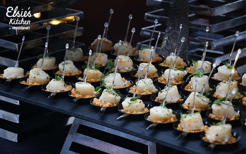Plated scallop appetizers served at a high-end corporate party