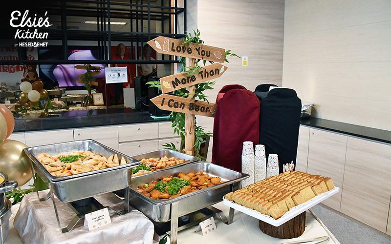 Themed buffet station with gourmet finger food and decor