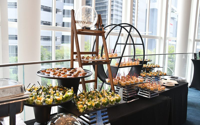 Professional catering setup featuring assorted gourmet finger foods.