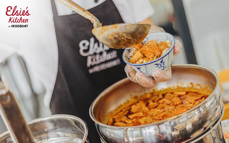 Elsie's Kitchen chef serving fresh locally sourced event meals.