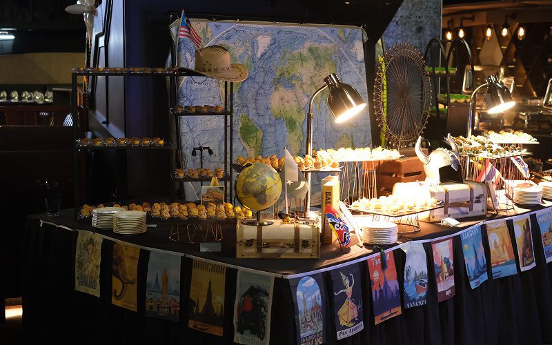 Elsie's Kitchen travel-themed buffet station for festival celebrations.