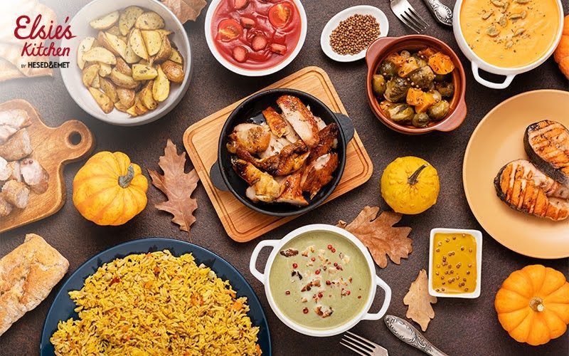 Flat lay of affordable catering dishes including chicken and rice.