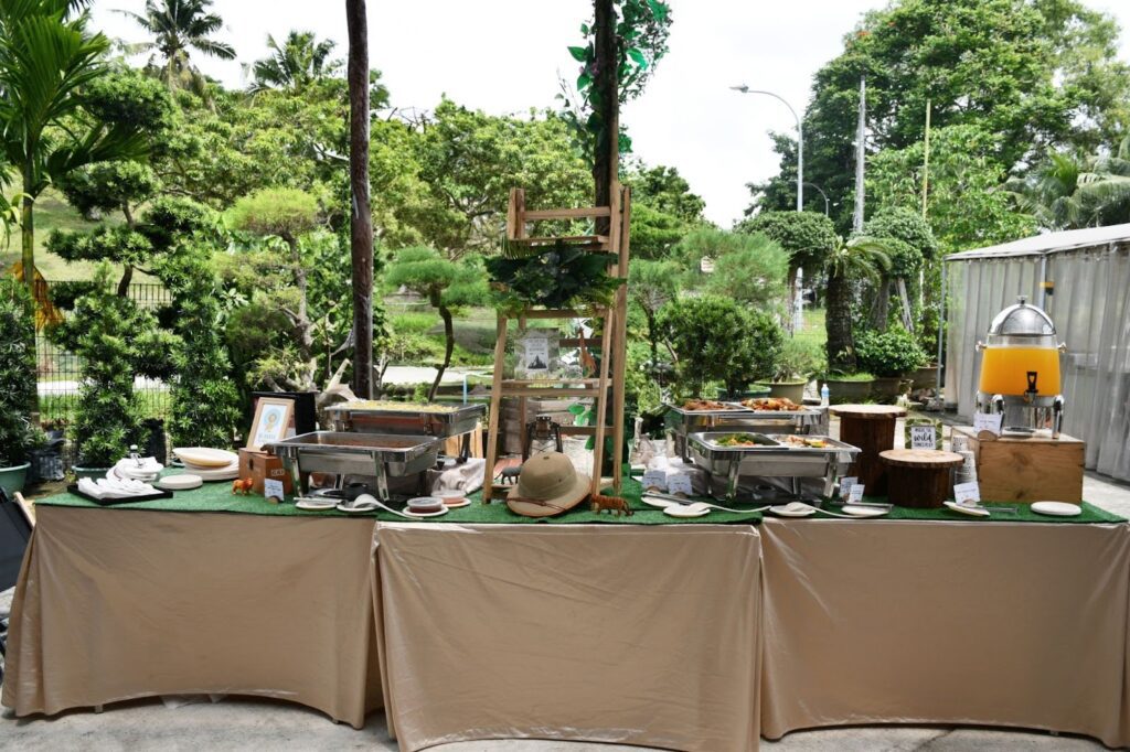 Outdoor buffet table set up for a children's celebration.