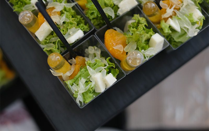 Individual salad cups reflecting Singapore's modern catering portion trends.