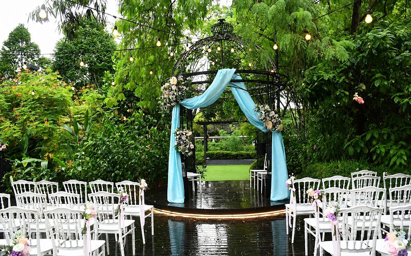 Decorated outdoor garden venue for Singapore catering event.