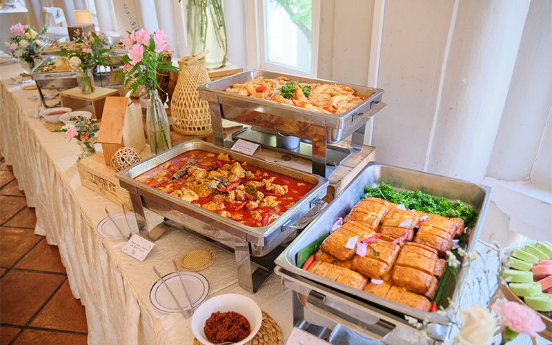 Compact housewarming catering setup suitable for narrow HDB spaces.