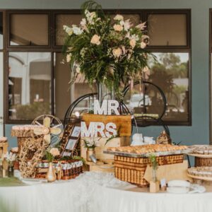 Rustic wedding catering buffet setup with floral decorations