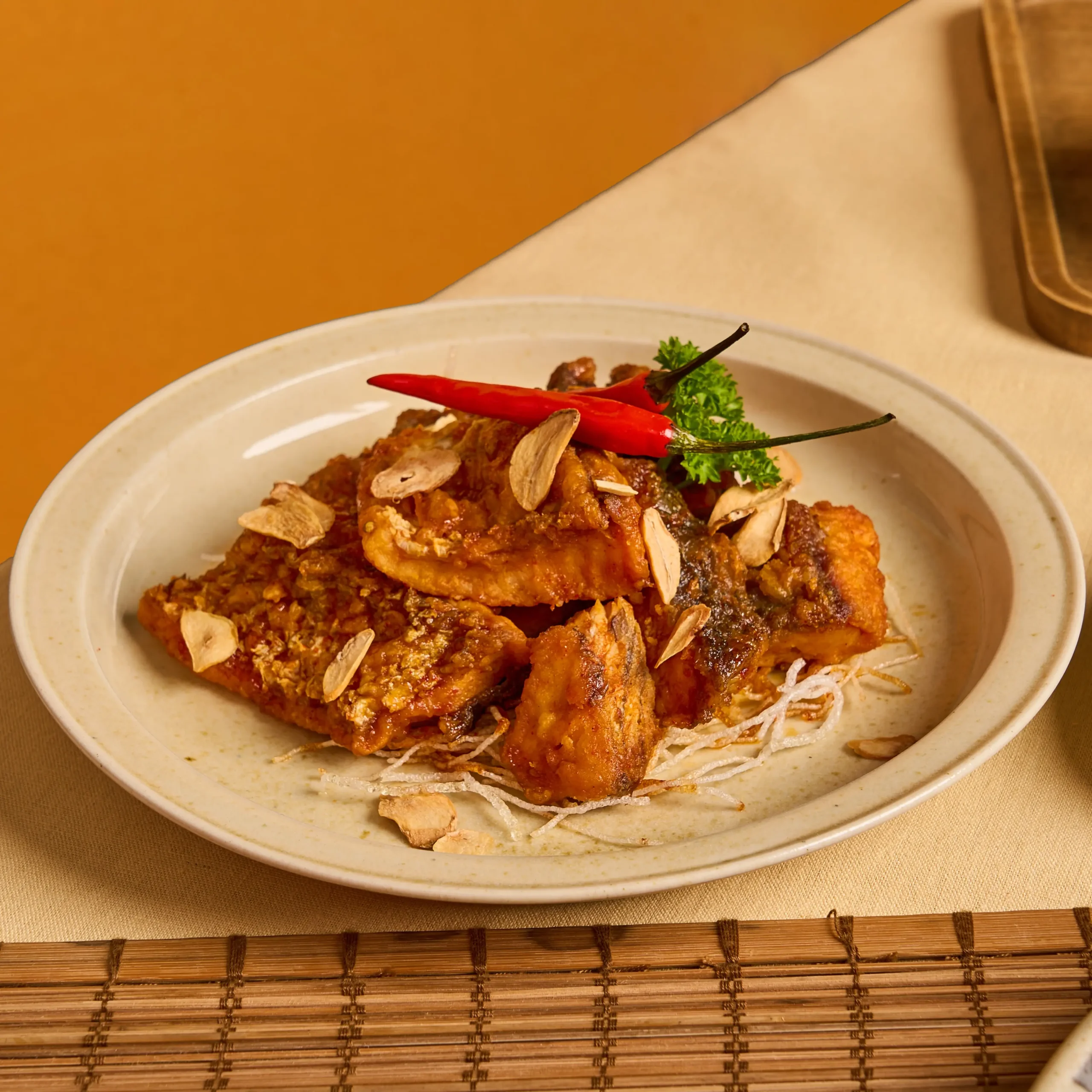 Crispy Deep Sea Barramundi with Spicy Tamarind Glaze & Garlic Chips