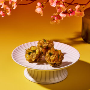Crispy salted egg honey joy cereal snacks in a serving bowl