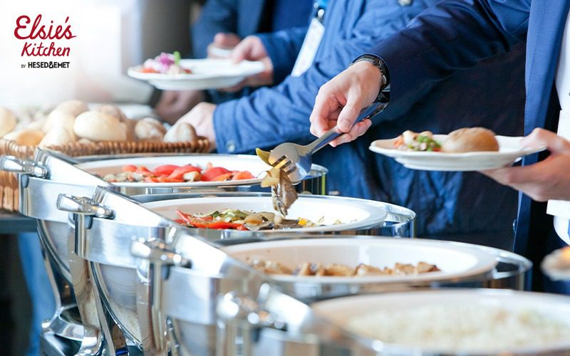 Guests serving themselves from a wedding brunch buffet