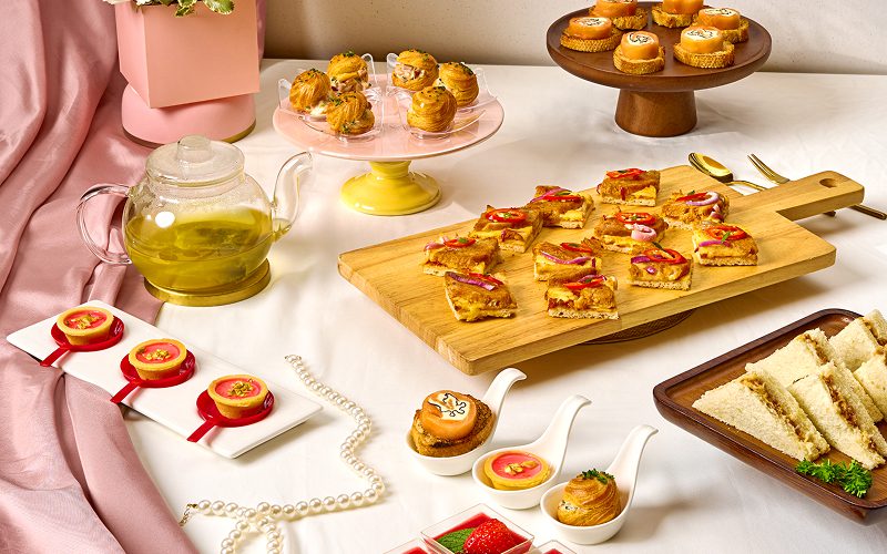 Assorted pastries and sandwiches for a themed high tea party.